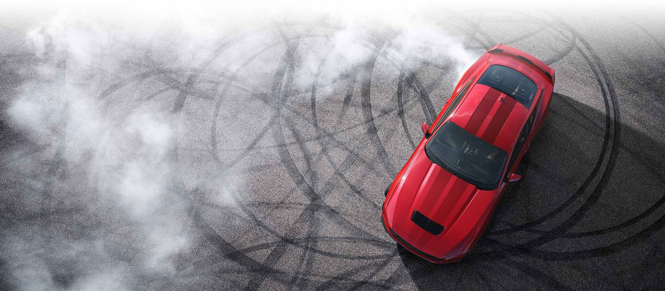 Overhead view of a 2024 Ford Mustang® model with tire tracks on pavement | Bird Kultgen Ford in Waco TX