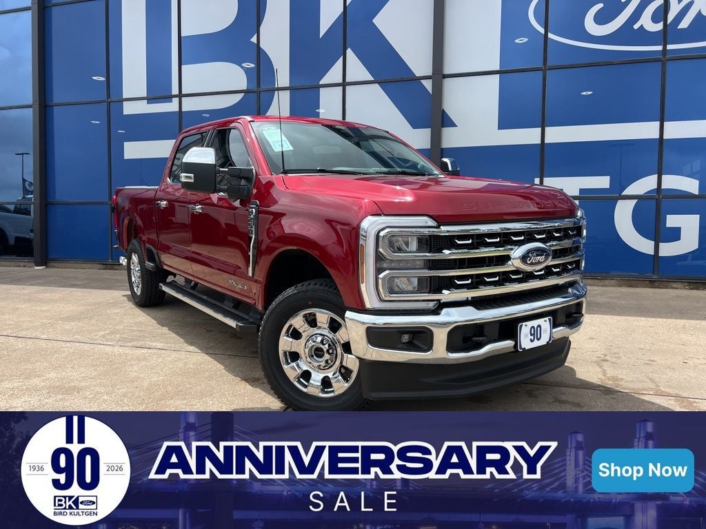 2026 Ford Super Duty F-250SD Lariat in Ruby Red Metallic Tinted Clearcoat — front three-quarter view
